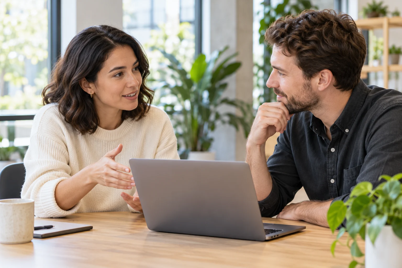 Two researchers working together in a bright studio